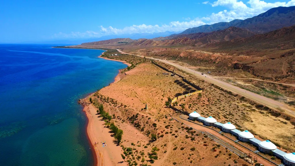 The southern shore of Issyk-Kul with a view of the road and the lake