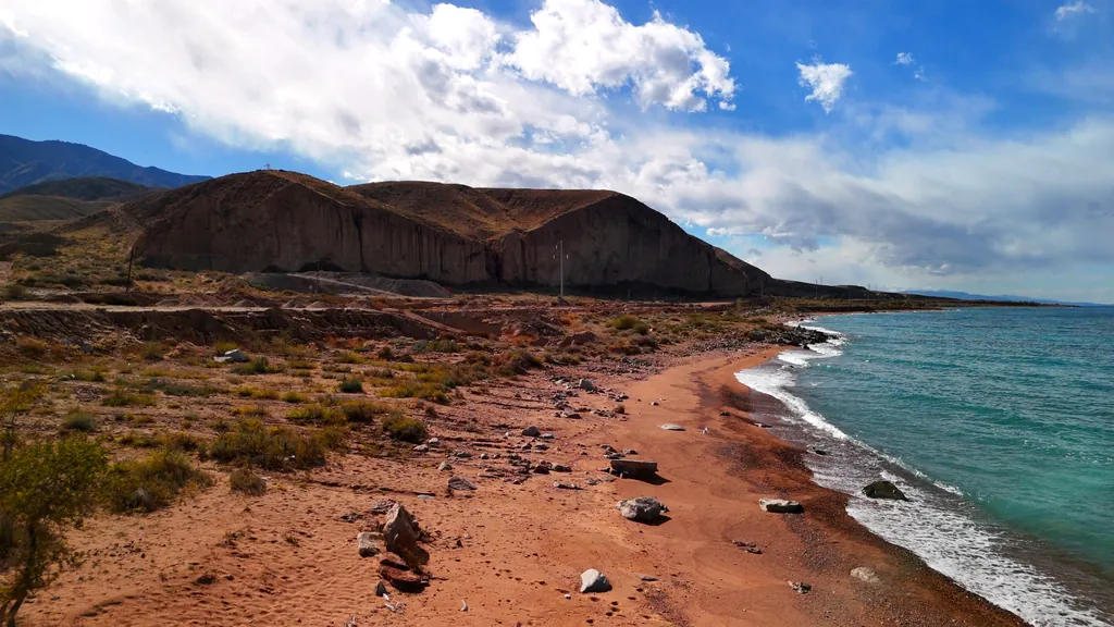 Lake Issyk-Kul, turquoise water and red rocks