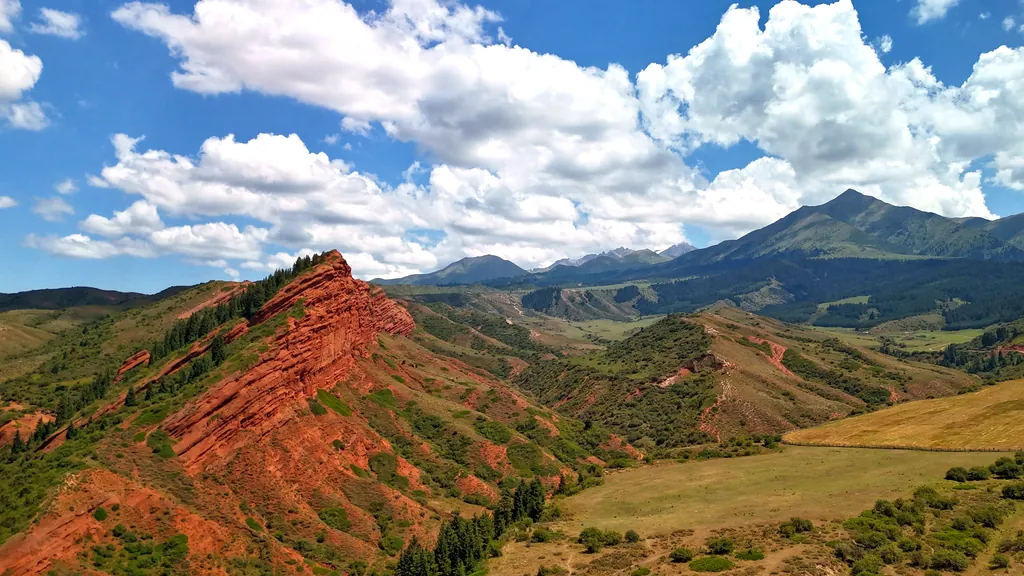 Alpine meadows and mountain peaks in the Jeti-Oguz Nature Reserve