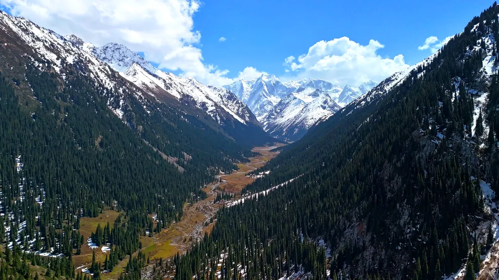 Fantastic view of snow-capped mountain peaks in Jeti-Oguz