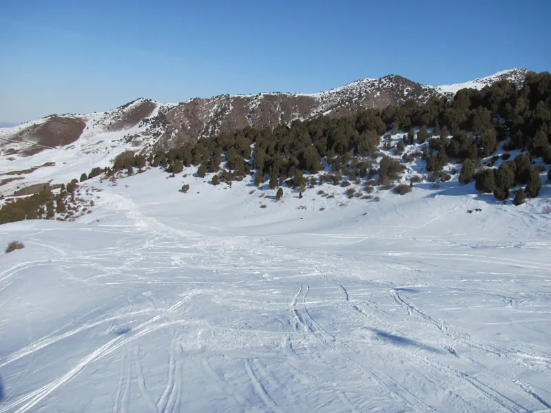 Winter snowy slope of Kashka-Suu in Kyrgyzstan