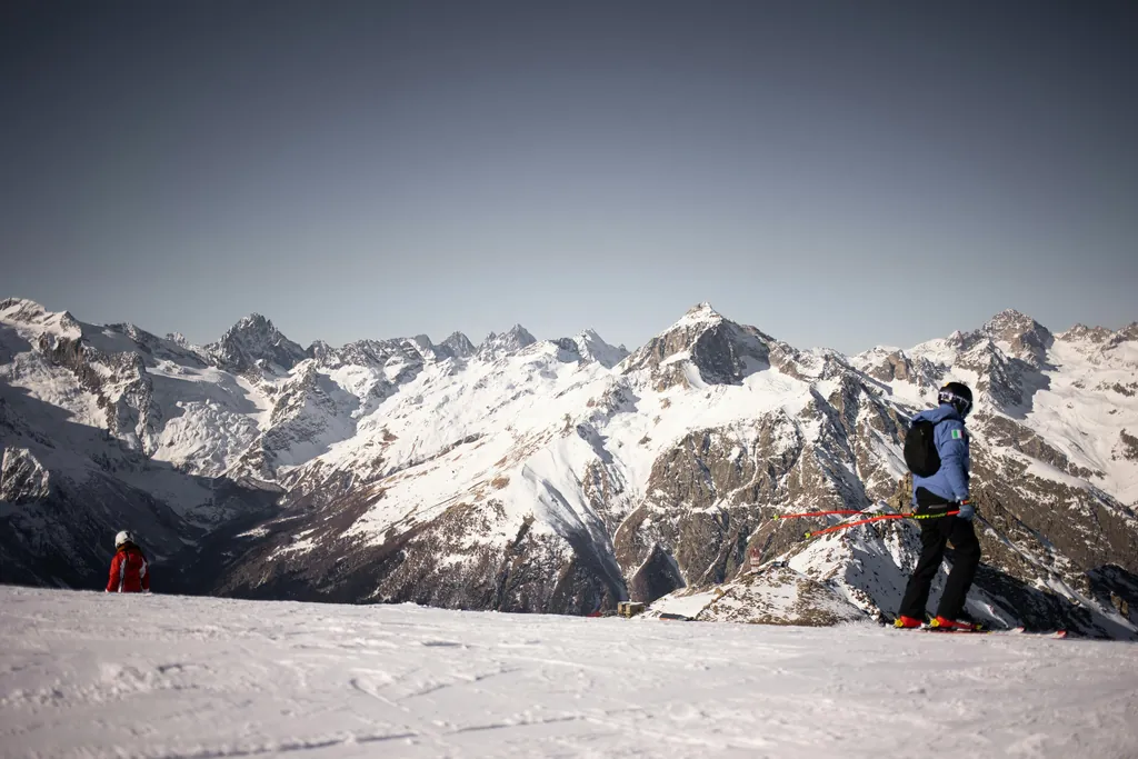 Skiers skiing at mountain resorts in Kyrgyzstan