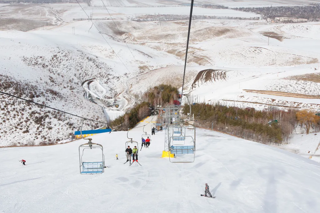 View of lifts and slope at Orlovka ski base in Kyrgyzstan