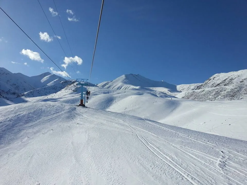 Lifts taking riders up the slope at Toguz-Bulak in Kyrgyzstan